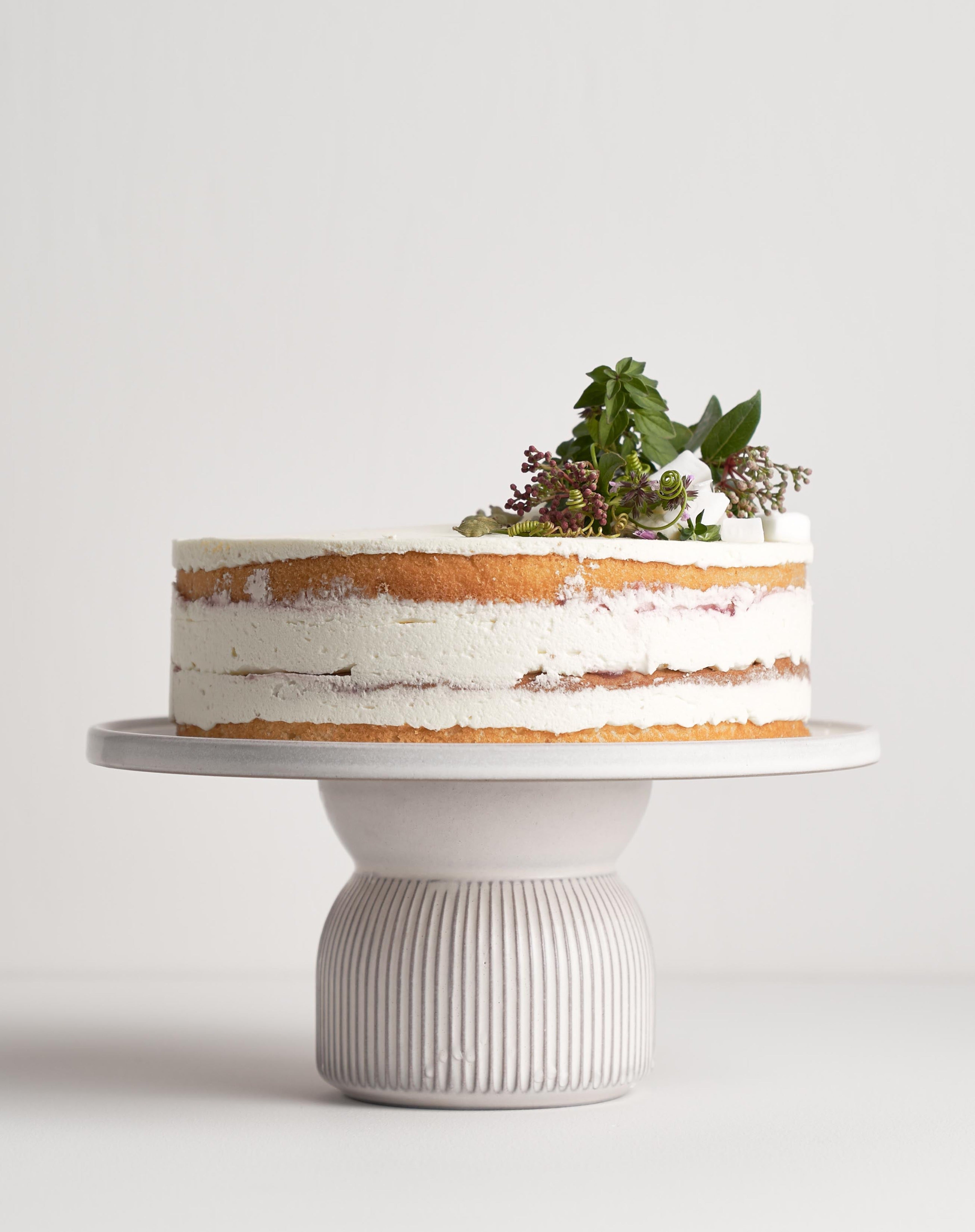 White Metal Pedestal Cake Stand 16 in. or 18 in. Round | Elite Events Rental